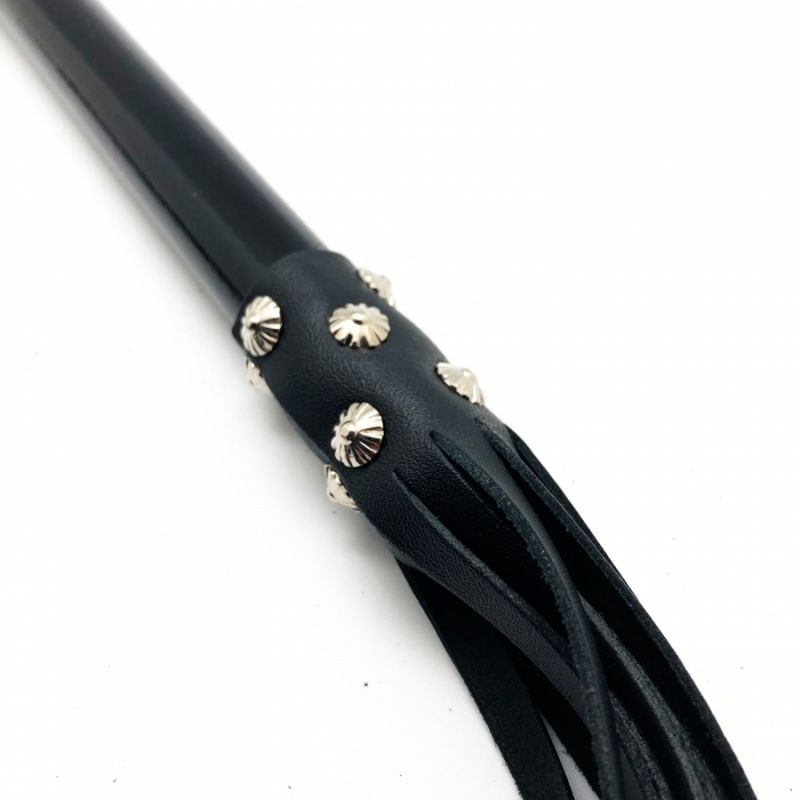 Large black BDSM flogger with long falls, fetish model in the Pulsion-SM style