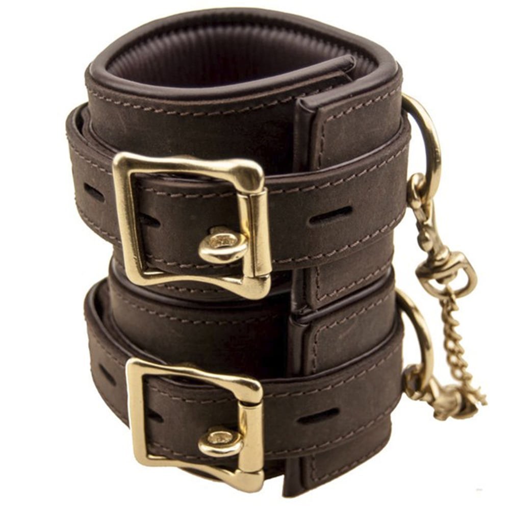 Pair of BDSM handcuffs in brown leather, handmade by Caresse de Cuir